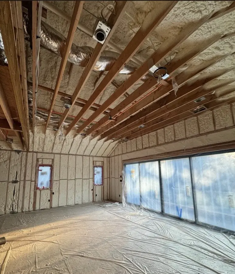 Interior walls and ceiling insulated with spray foam during new construction in Antrim